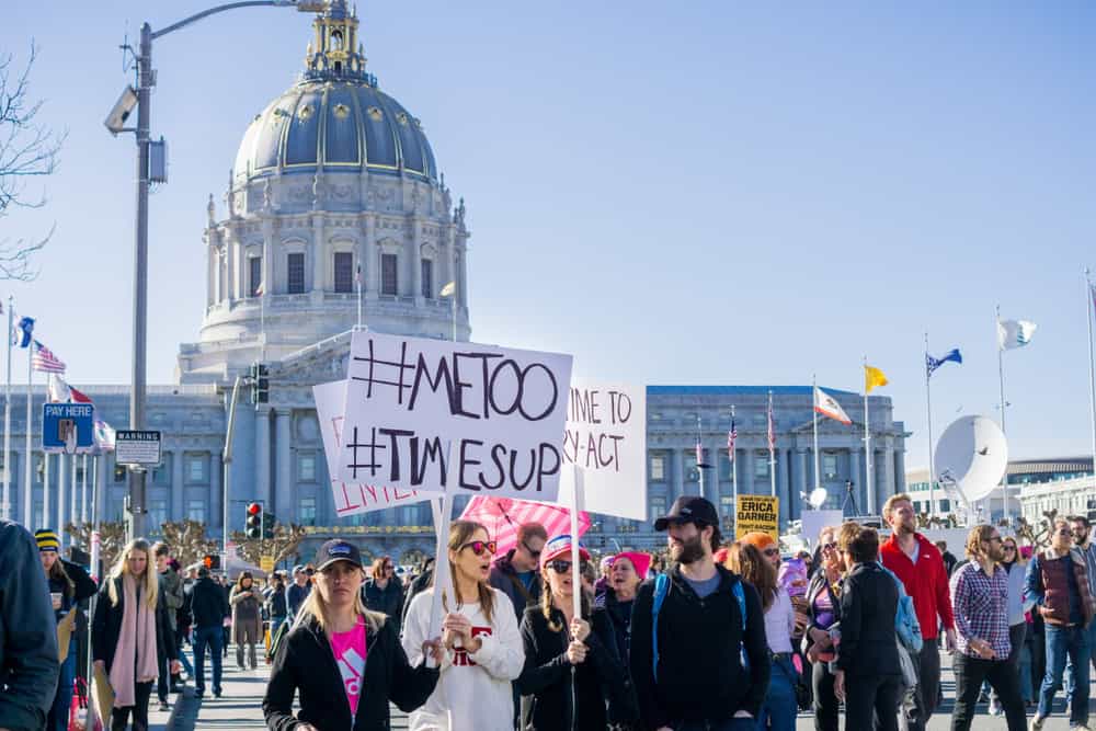 Protesters holding #MeToo sign