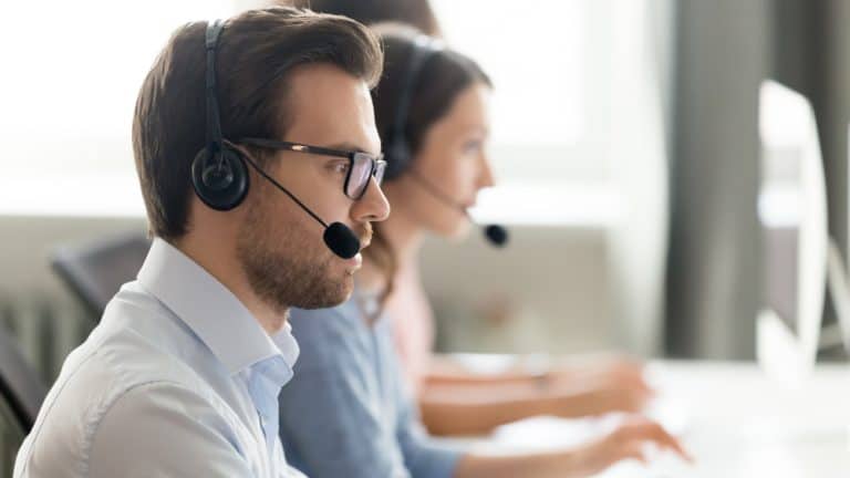 "Intake specialist wearing a headset, ready to assist survivors confidentially