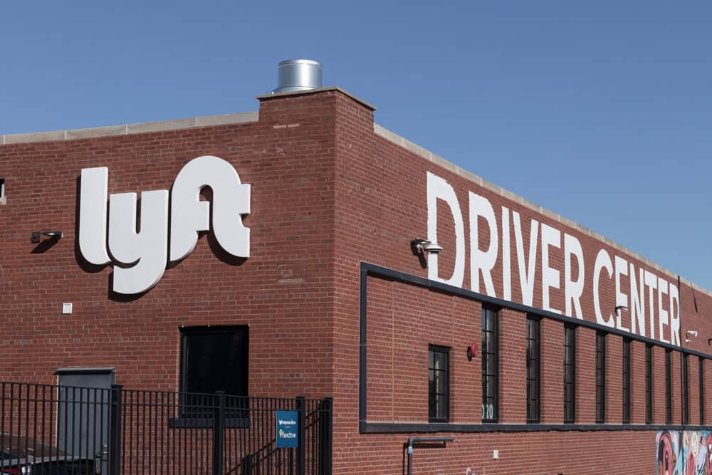 Exterior view of a red-brick building labeled "Lyft Driver Center."