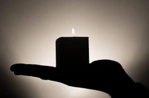 Silhouette of a candle, symbolically in memory of SBC sexual abuse survivor, Jennifer Lyell.