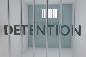 An image bearing the word "detention," indicative of a juvenile detention Center in Illinois, where hundreds of survivors of sexual abuse have filed lawsuits.