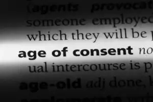 The term "age of consent" is highlighted in the dictionary.