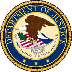 Seal of the United States Department of Justice, featuring a bald eagle surrounded by a blue and gold border