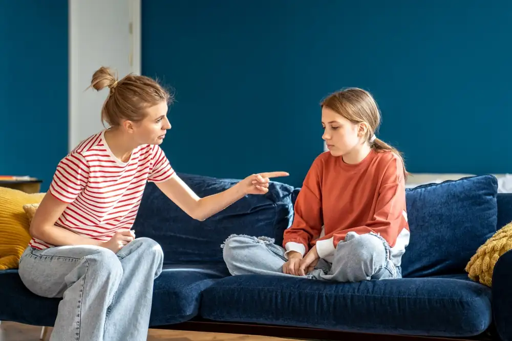 A mother scolding her child.