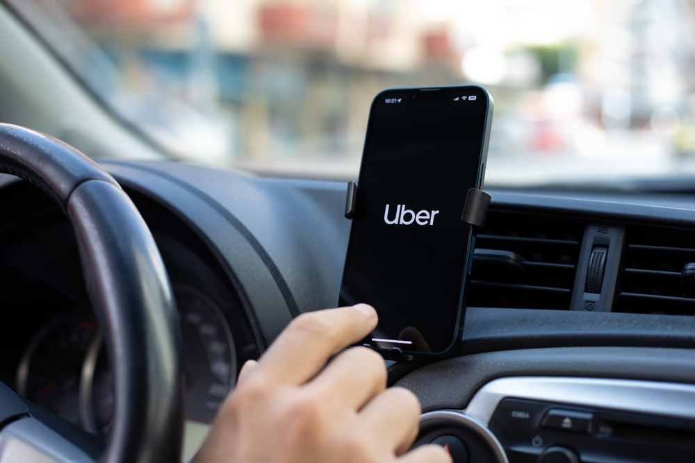 Apple iPhone 14 with application Taxi Uber in the screen