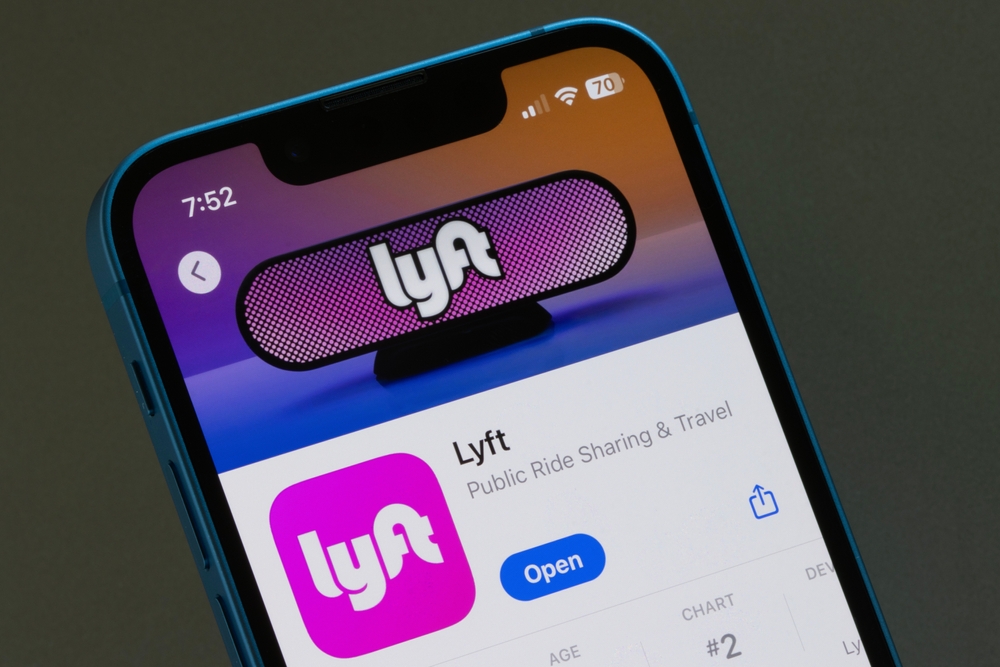 Lyft app is seen in the App Store on the screen of an iPhone.