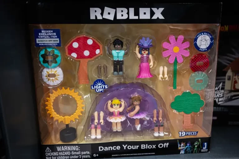 Close-up of a boxed Roblox “Dance Your Blox Off” toy set featuring multiple miniature figures, flowers, and accessories on display in a store.