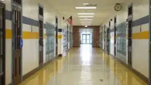 Empty hallway inside an elementary school representing allegations of institutional failures to protect students from sexual abuse
