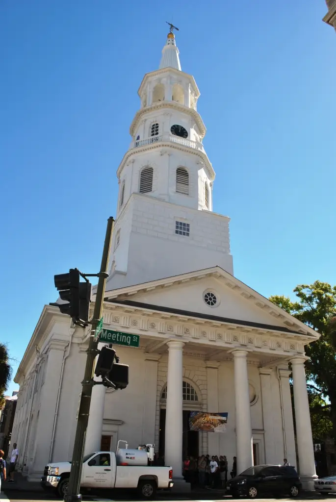 St. Michael’s Episcopal Church in Charleston, South Carolina, featuring its white steeple and columned entrance on the corner of Meeting Street.