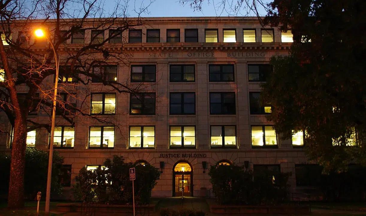 Oregon Department of Justice headquarters in Salem, Oregon, located in the State Office Building, illuminated during evening hours