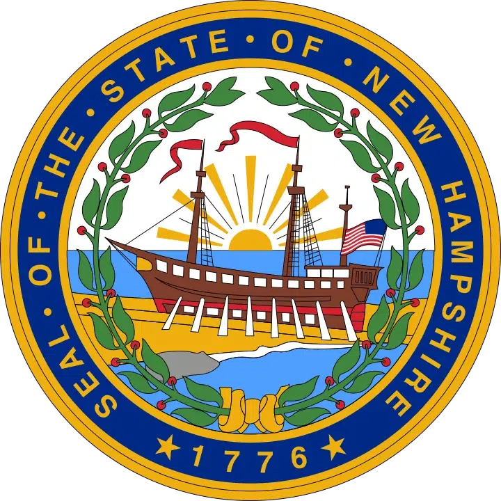 The official Seal of the State of New Hampshire, featuring a ship on the water with a rising sun and laurel leaves encircling the design.