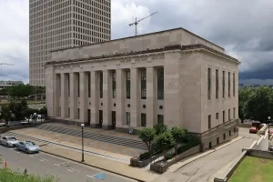 Exterior view of the Tennessee Supreme Court building in Nashville, a large stone courthouse with columns and steps, photographed on an overcast day.