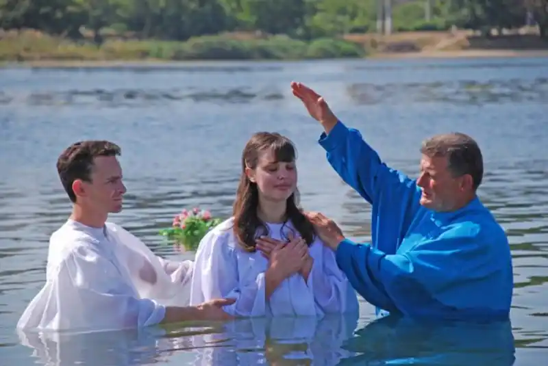 Baptism ceremony in a Christian church, symbolizing religious institutions discussed in coverage of Southern Baptist clergy sexual abuse and accountability.