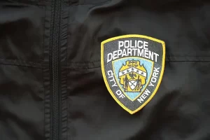 nypd-patch NYPD patch on officer’s jacket, symbolizing Brooklyn Child Abuse Squad investigation into daycare teacher charged with sexual abuse.
