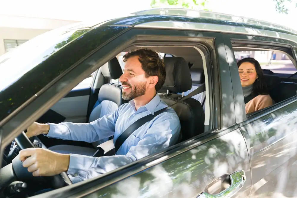 Rideshare driver transporting a passenger, illustrating AI-driven safety monitoring and predictive risk modeling in ride-hailing services.
