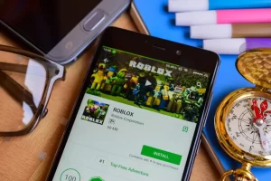 Roblox app displayed on a smartphone screen, illustrating online gaming platforms where children may be exposed to grooming and exploitation risks.