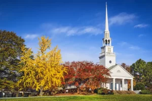 southern-baptist-church Southern Baptist church building with white steeple in autumn, representing Baptist institutions amid ongoing sexual abuse accountability efforts.