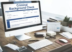 uber-background-check (1) Computer screen displaying a criminal background check form, representing Uber’s move toward stricter driver screening and safety policies.