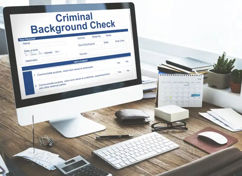 Computer screen displaying a criminal background check form, representing Uber’s move toward stricter driver screening and safety policies.