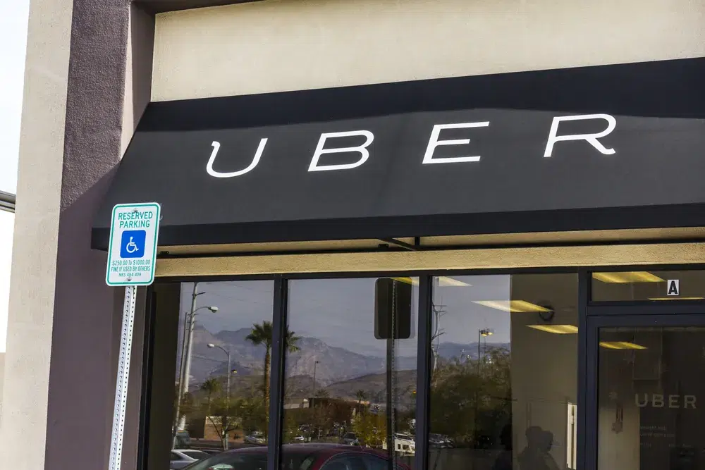 Uber storefront signage displayed on a commercial building, representing the rideshare company amid ongoing sexual assault litigation and federal court proceedings.