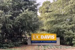 uc-davis-campus-sign UC Davis campus entrance sign surrounded by trees, photographed near the University of California, Davis.