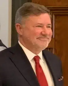 gentner-drummond-2024 Oklahoma Attorney General Gentner Drummond, wearing a dark suit and red tie, seated indoors. File size: 27 KB. Alt text: Oklahoma Attorney General Gentner Drummond, wearing a dark suit and red tie, seated indoors.