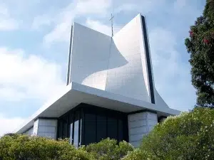 st-marys-cathedral-san-francisco-900-q80 St. Mary’s Cathedral in San Francisco, a modern white church building with a cross rising above the roofline.