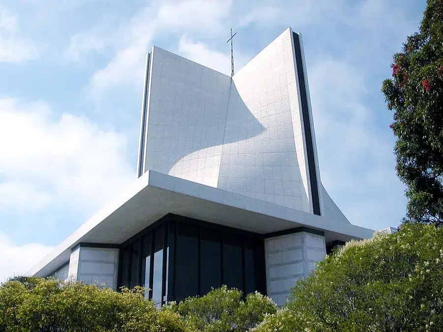 st-marys-cathedral-san-francisco-900-q80 St. Mary’s Cathedral in San Francisco, a modern white church building with a cross rising above the roofline.