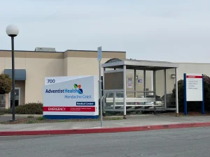 adventist Adventist Health Mendocino Coast medical center in Fort Bragg, California, with hospital and emergency entrance signage visible.