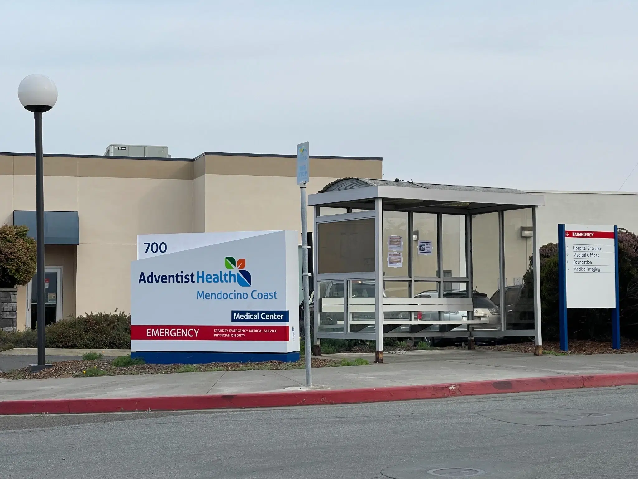 adventist Adventist Health Mendocino Coast medical center in Fort Bragg, California, with hospital and emergency entrance signage visible.