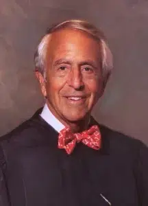 judge-charles-breyer Official portrait of U.S. District Judge Charles Breyer wearing a dark judicial robe and red bow tie.