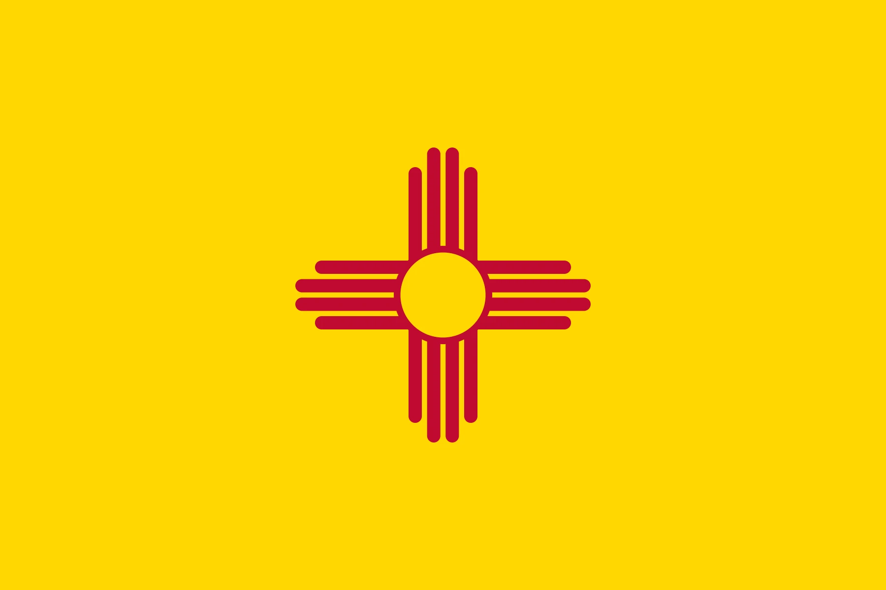 new-mexico-flag Flag of New Mexico featuring a red Zia sun symbol centered on a yellow field.