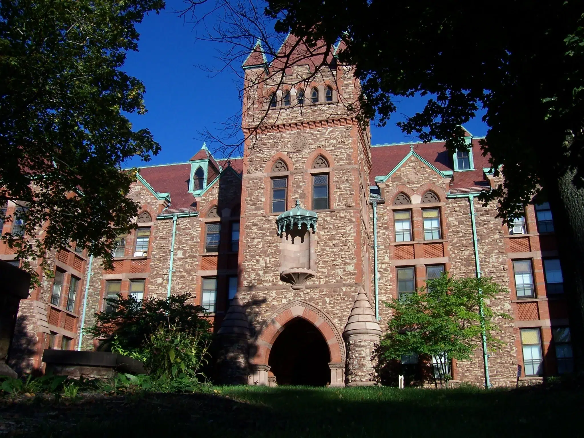st-bernards-seminary-rochester-ny Former St. Bernard’s Seminary in Rochester, New York, a historic stone Catholic seminary building with a central tower and arched entrance.