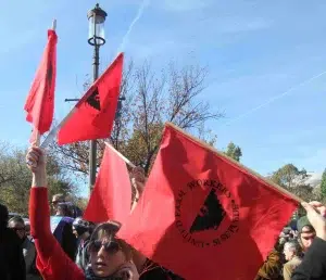united-farm-workers-rally United Farm Workers supporters holding red UFW flags at a rally.